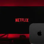 Imagem de uma televisão com a Netflix e um dispositivo Apple Tv na frente