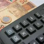 Com aumento da Selic, bancos querem elevar teto de juros do consignado | banco central