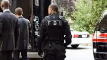 Agente do FBI em trabalho, em alusão à nota do departamento de óvnis do grupo