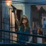 Lucélia, com o comparsa ao fundo | Foto: Reprodução/Globo - narcocultura