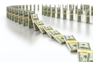 Pilhas de dólares formando efeito dominó representando impacto financeiro e econômico