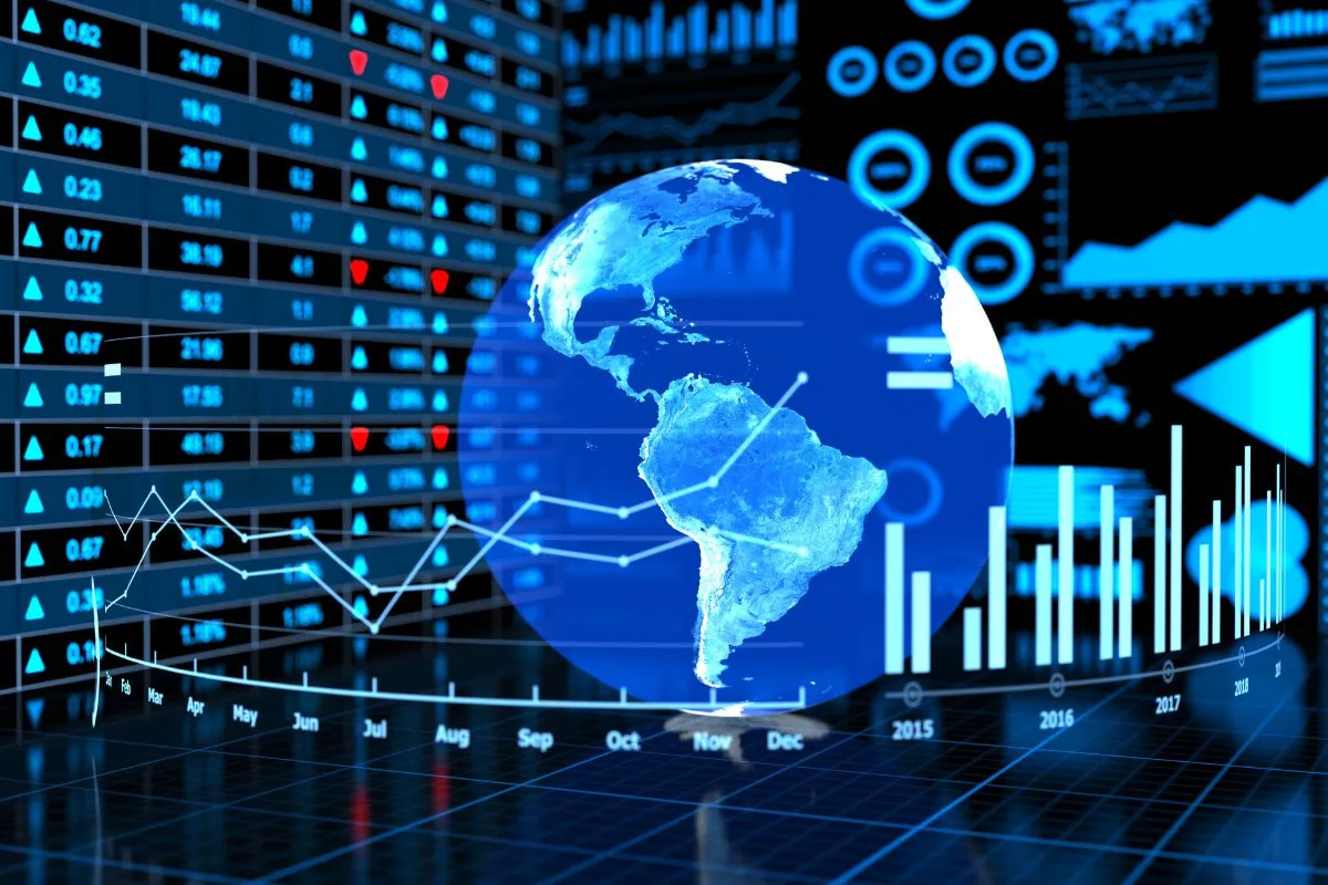 Globo terrestre com gráficos financeiros e dados de mercado representando economia global