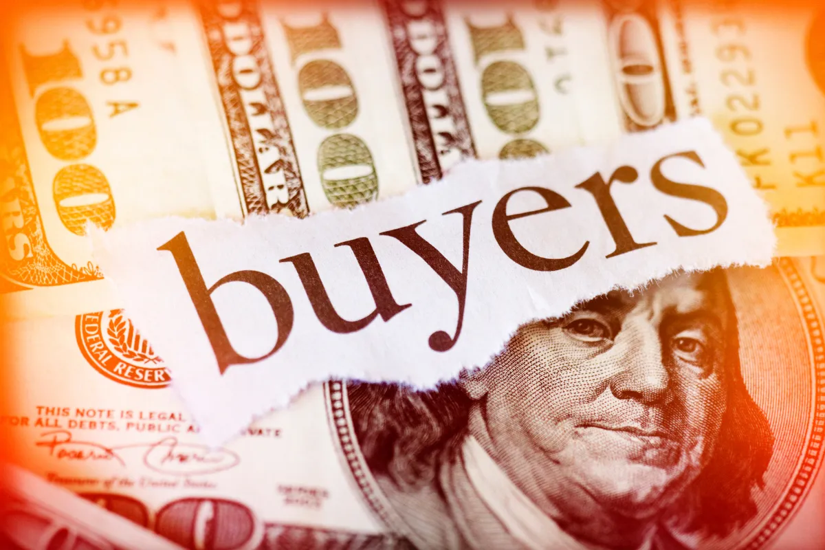 Palavra "buyers" sobre notas de dólar representando compradores internacionais do agronegócio e comércio exterior.